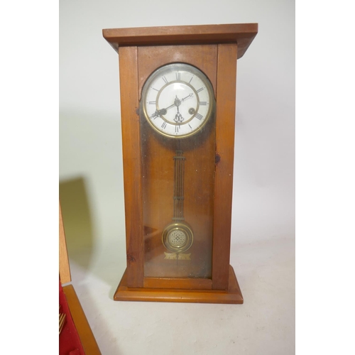 665 - A Sheffield silver plated eight place cutlery service in canteen, and a Vienna wall clock in later c... 