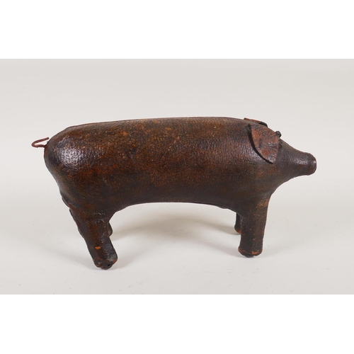 7 - A vintage Liberty style leather pig door stop in the manner of Dimitri Omersa, 24cm long