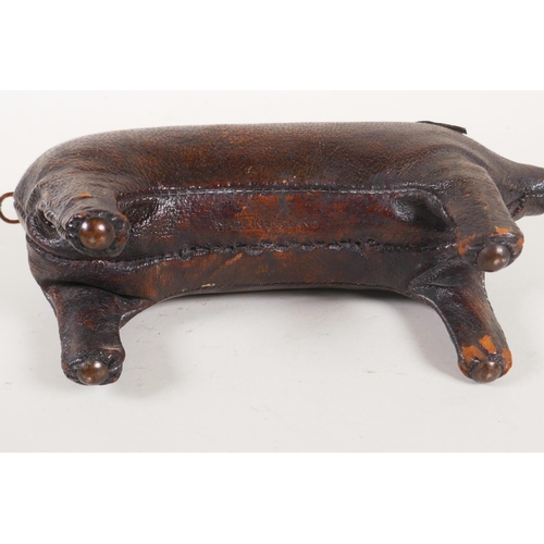 7 - A vintage Liberty style leather pig door stop in the manner of Dimitri Omersa, 24cm long