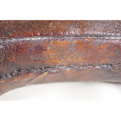 7 - A vintage Liberty style leather pig door stop in the manner of Dimitri Omersa, 24cm long