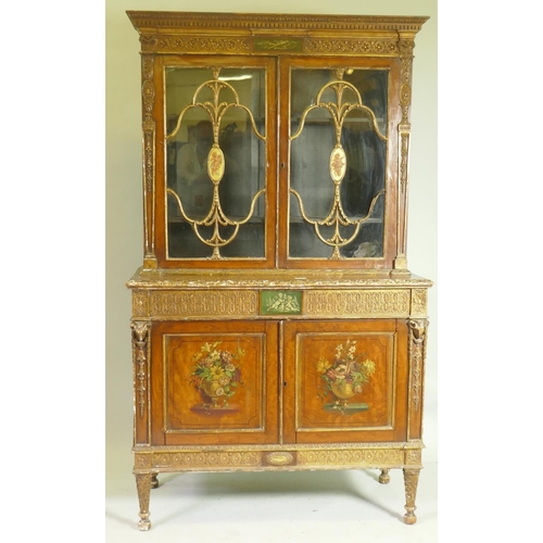 1001 - A C19th satinwood Sheraton Revival cabinet in two sections, with painted and parcel gilt decoration,...