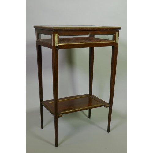 1006 - A Victorian inlaid rosewood bijouterie table with brass mounts, raised on tapering supports united b... 