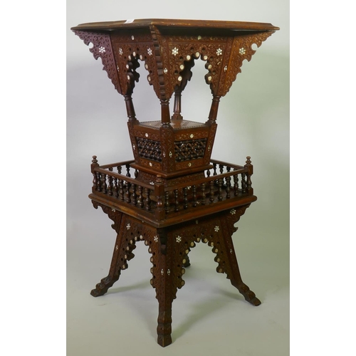 1007 - A Moorish hardwood table/stand, with carved decoration and mother of pearl inlay, decorated with Isl... 