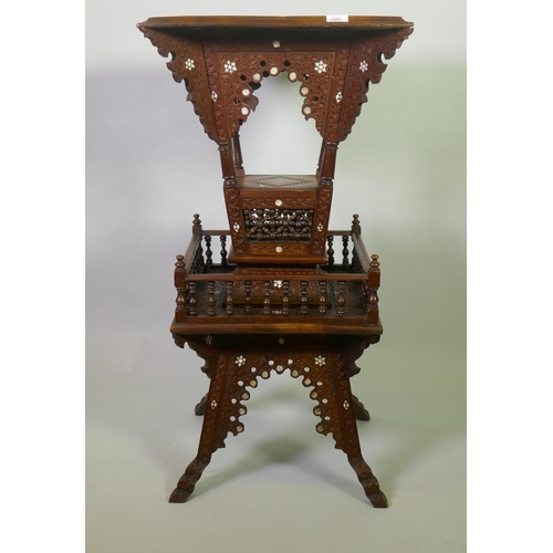1007 - A Moorish hardwood table/stand, with carved decoration and mother of pearl inlay, decorated with Isl... 