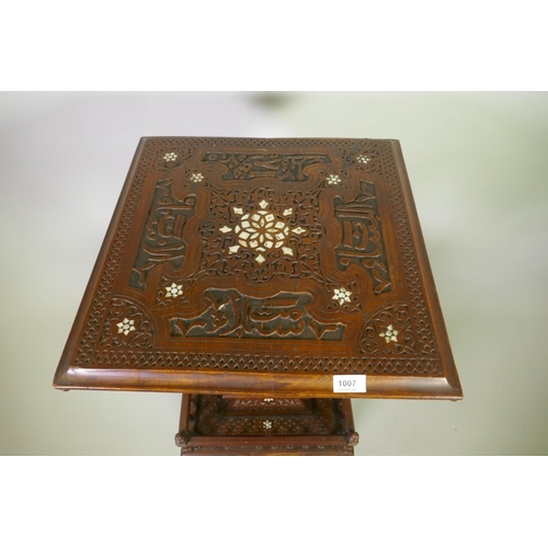 1007 - A Moorish hardwood table/stand, with carved decoration and mother of pearl inlay, decorated with Isl... 