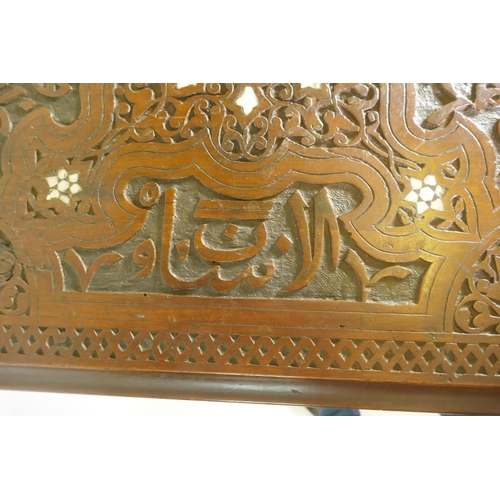 1007 - A Moorish hardwood table/stand, with carved decoration and mother of pearl inlay, decorated with Isl... 
