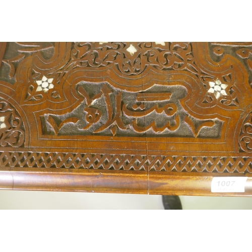 1007 - A Moorish hardwood table/stand, with carved decoration and mother of pearl inlay, decorated with Isl... 