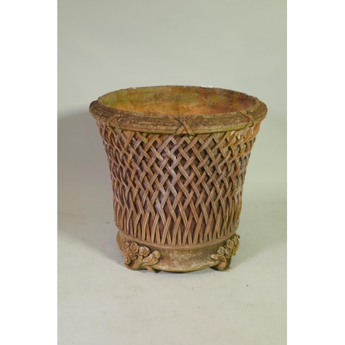 1021 - A terracotta garden planter/jardiniere with applied decoration, 55cm diameter, 51cm high
