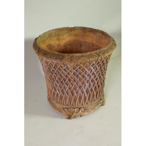 1021 - A terracotta garden planter/jardiniere with applied decoration, 55cm diameter, 51cm high