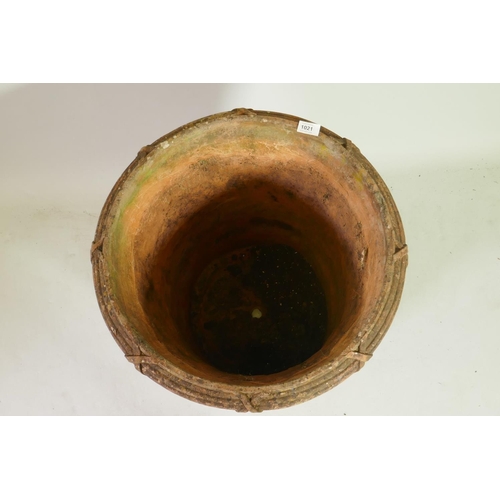 1021 - A terracotta garden planter/jardiniere with applied decoration, 55cm diameter, 51cm high