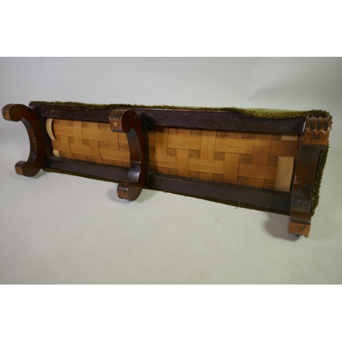 1034 - A C19th mahogany fender stool, raised on scroll supports, 125 x 34 x 24cm