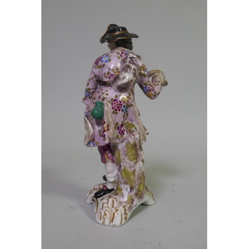 18 - Pair of late C18th/C19th soft paste porcelain figures, possibly Derby, of a street vendor and a hunt... 