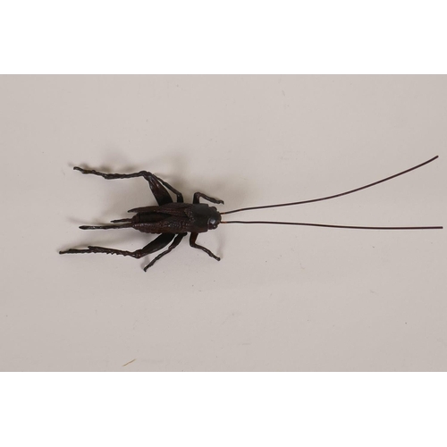 32 - A Japanese Jizai style bronzed copper okimono grasshopper with articulated limbs, 17cm long