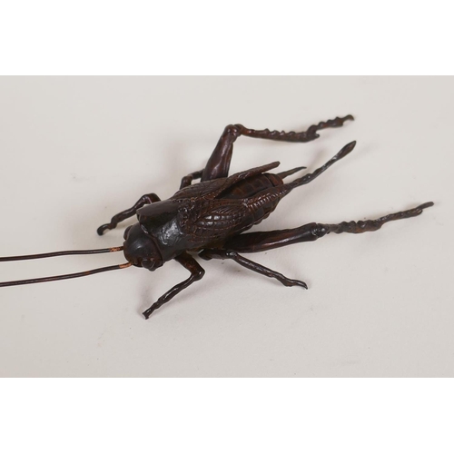 32 - A Japanese Jizai style bronzed copper okimono grasshopper with articulated limbs, 17cm long