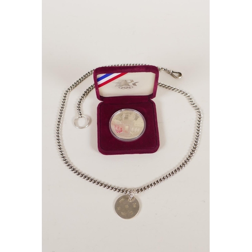 613 - A hallmarked silver fob chain by David Thomas, (London, 1999, with a millennium mark, 55g), and a Un... 