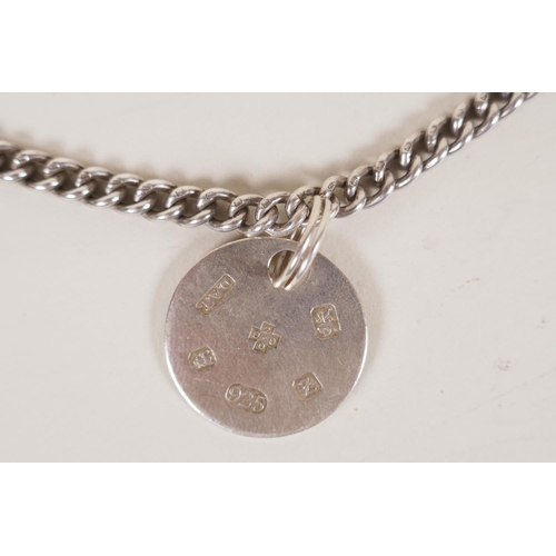 613 - A hallmarked silver fob chain by David Thomas, (London, 1999, with a millennium mark, 55g), and a Un... 