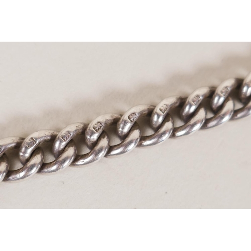 613 - A hallmarked silver fob chain by David Thomas, (London, 1999, with a millennium mark, 55g), and a Un... 