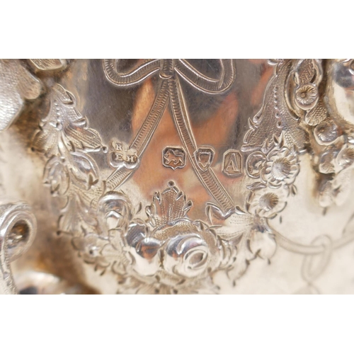 602 - A fine Victorian silver three piece tea set by Martin, Hall & Co, London, 1876, decorated with r... 