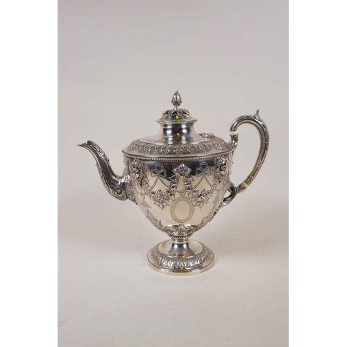 602 - A fine Victorian silver three piece tea set by Martin, Hall & Co, London, 1876, decorated with r... 
