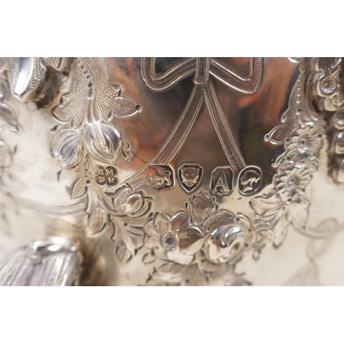 602 - A fine Victorian silver three piece tea set by Martin, Hall & Co, London, 1876, decorated with r... 