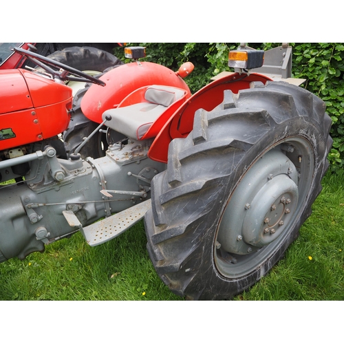 107 - Massey Ferguson 65 tractor. Runs and drives. C/w with Ferguson winch. Restored