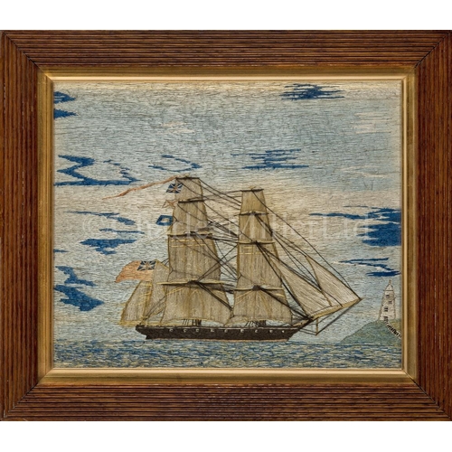 231 - A 19TH CENTURY SAILOR'S SILKWORK PICTURE 
depicting a fully rigged frigate with red ensign sailing o... 