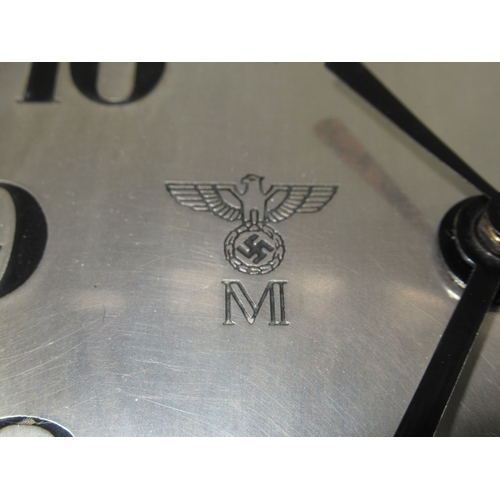 267 - A KRIEGSMARINE U-BOAT CLOCK
the 6¼in. silvered dial marked with Kriegsmarine device, black spade han... 