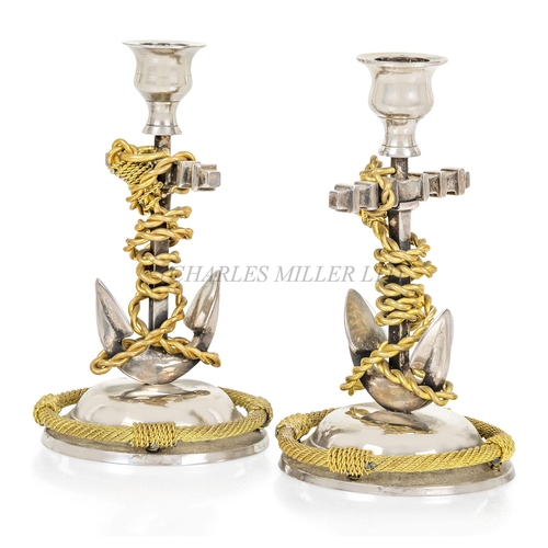 140 - PAIR OF MARINE-THEMED CANDLESTICKSthe stems comprising a pair of fouled anchors on stepped bases wit... 