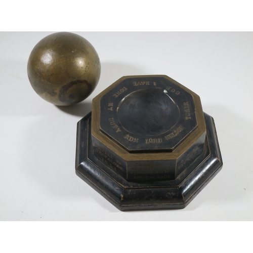 144 - A 1905 TRAFALGAR CENTENARY CANNON BALL AND STAND COMMEMORATING H.M.S. VICTORY'S BATTLEScomprising a ... 