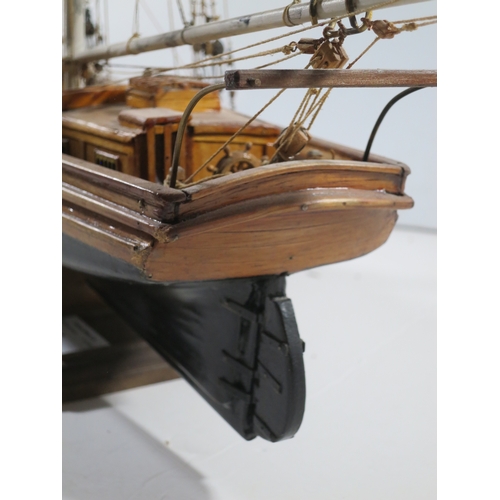 5 - A WELL-RIGGED MODEL OF A 19TH CENTURY TWIN-MASTED TRADING SCHOONERwith planked and pinned hull paint... 