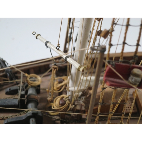 5 - A WELL-RIGGED MODEL OF A 19TH CENTURY TWIN-MASTED TRADING SCHOONERwith planked and pinned hull paint... 