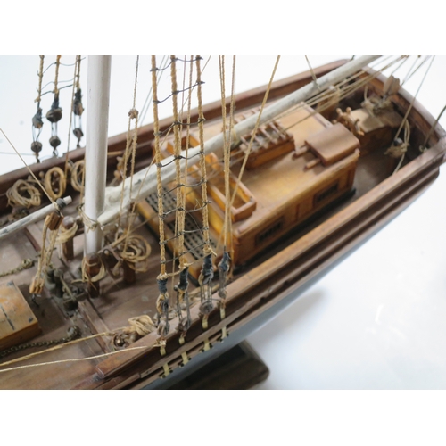 5 - A WELL-RIGGED MODEL OF A 19TH CENTURY TWIN-MASTED TRADING SCHOONERwith planked and pinned hull paint... 