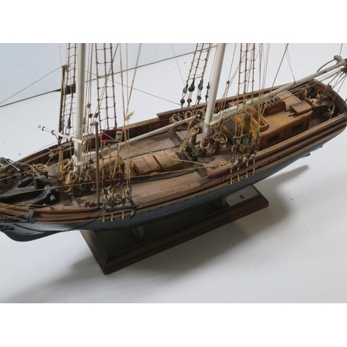 5 - A WELL-RIGGED MODEL OF A 19TH CENTURY TWIN-MASTED TRADING SCHOONERwith planked and pinned hull paint... 