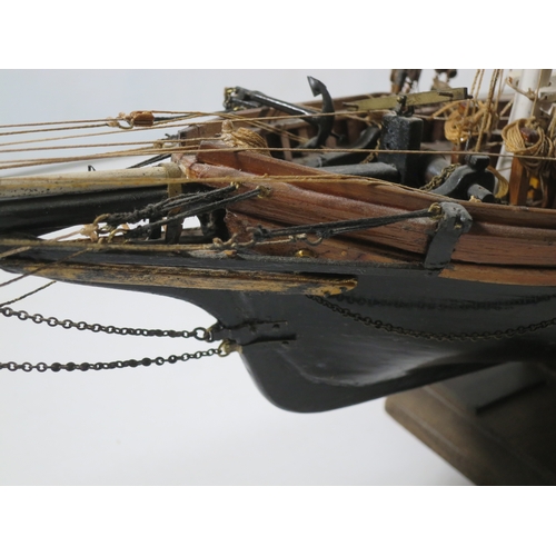 5 - A WELL-RIGGED MODEL OF A 19TH CENTURY TWIN-MASTED TRADING SCHOONERwith planked and pinned hull paint... 