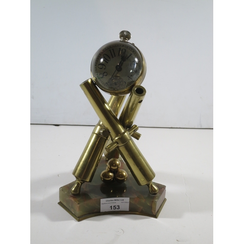 153 - A NOVELTY DESK CLOCK, CIRCA 1900formed as three cannon barrels supporting a 2½in. diameter glass glo... 