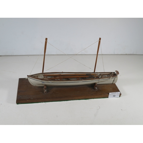 15 - 19TH CENTURY SAILOR-TYPE MODEL FOR A CORNISH PILOT GIG with 11in. hull carved from the solid and con... 