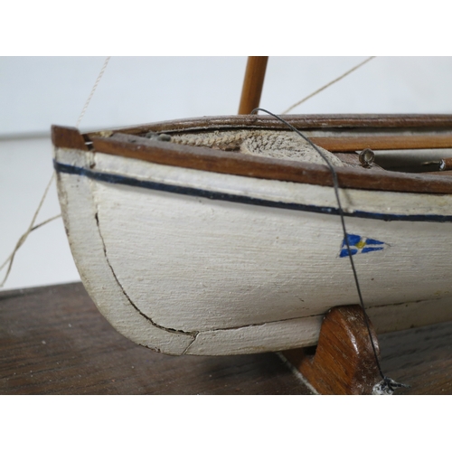 15 - 19TH CENTURY SAILOR-TYPE MODEL FOR A CORNISH PILOT GIG with 11in. hull carved from the solid and con... 