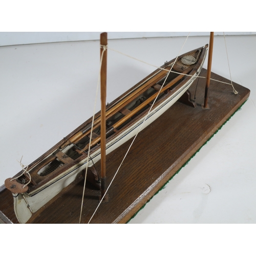 15 - 19TH CENTURY SAILOR-TYPE MODEL FOR A CORNISH PILOT GIG with 11in. hull carved from the solid and con... 