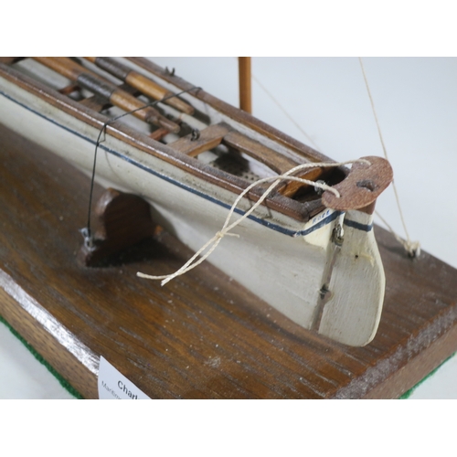 15 - 19TH CENTURY SAILOR-TYPE MODEL FOR A CORNISH PILOT GIG with 11in. hull carved from the solid and con... 