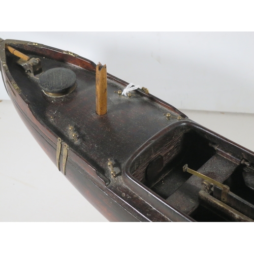 18 - AN ATTRACTIVE MODEL OF A LUG-RIGGED, DROP-KEEL CANOE, CIRCA 1890the 19in. carved hull carved from th... 