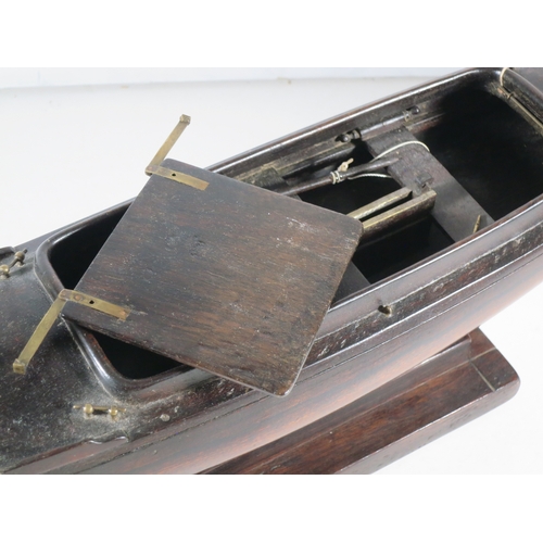 18 - AN ATTRACTIVE MODEL OF A LUG-RIGGED, DROP-KEEL CANOE, CIRCA 1890the 19in. carved hull carved from th... 