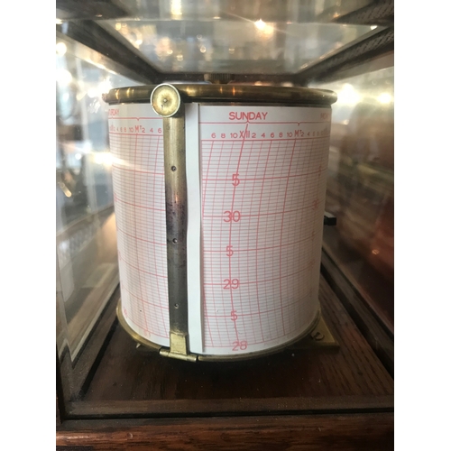 231 - A RECORDING BAROGRAPH RETAILED BY HARRODS, LONDON, CIRCA 1920oak case with ivorine retailer's plate,... 