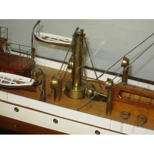 54 - A MODEL OF THE STEAM YACHT VENUS, CIRCA 1902the 40in. carved hull painted tan below the waterline, b... 