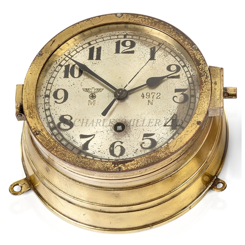 246 - A KRIEGSMARINE U-BOAT BULKHEAD CLOCK
the 6¼in. silvered dial marked with Kriegsmarine device numbere... 