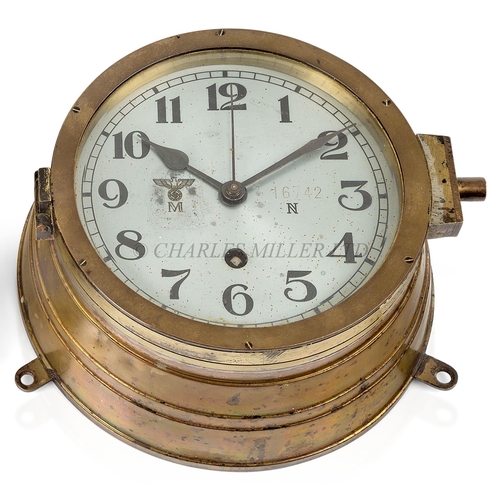 247 - A KRIEGSMARINE U-BOAT BULKHEAD CLOCK
the 6¼in. silvered dial marked with Kriegsmarine device numbere... 