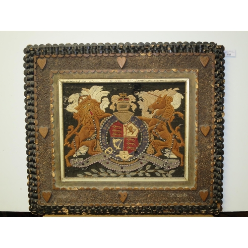 181 - A 19TH CENTURY SAILOR'S WOOLWORK PICTURE AND FRAME
depicting the Royal Arms with raised silkwork lio... 