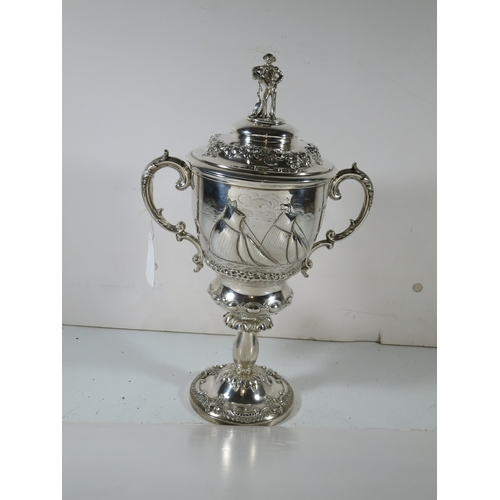 32 - A 19TH CENTURY SILVER YACHTING TROPHY
comprising a two handled covered cup repoussé yacht racing sce... 