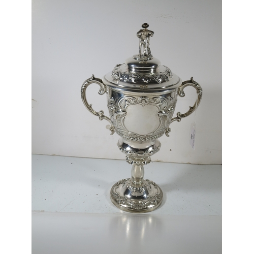 32 - A 19TH CENTURY SILVER YACHTING TROPHY
comprising a two handled covered cup repoussé yacht racing sce... 