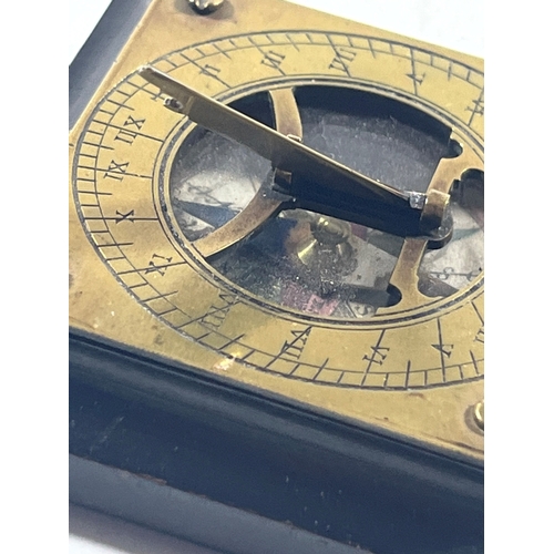 117 - A LATE 19TH CENTURY PORTABLE COMPASS SUNDIAL
unsigned with engraved brass plate, fixed latitude fold... 