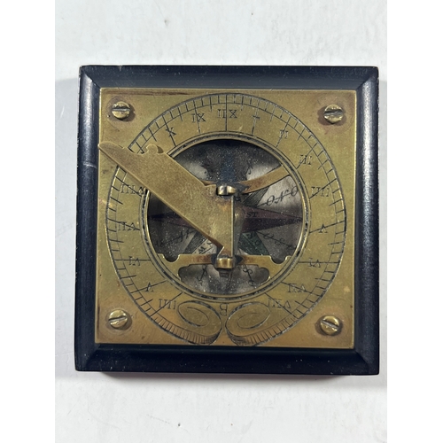 117 - A LATE 19TH CENTURY PORTABLE COMPASS SUNDIAL
unsigned with engraved brass plate, fixed latitude fold... 